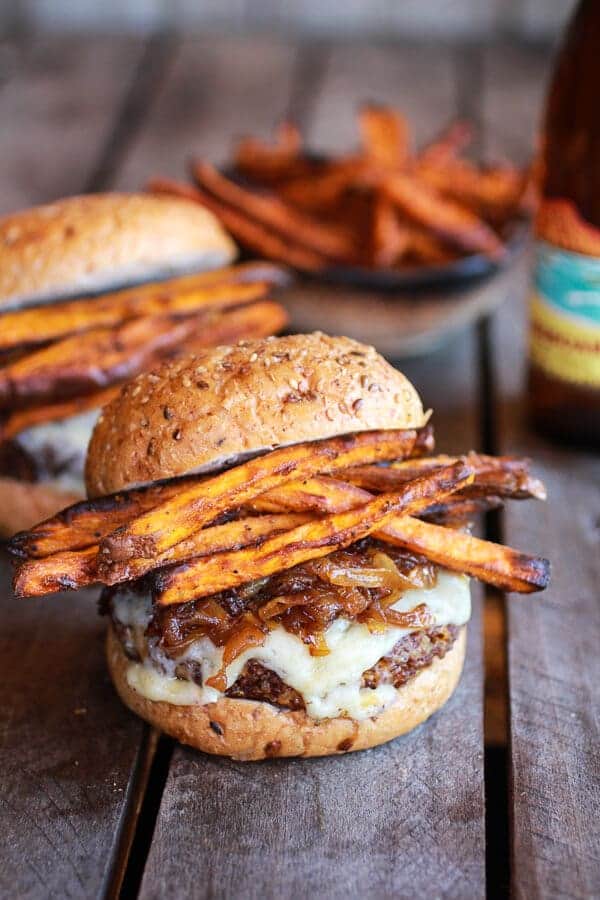 Epic Crispy Quinoa Burgers Topped with Sweet Potato Fries, Beer Caramelized Onions + Gruyere | halfbakedharvest.com #quinoa #healthy