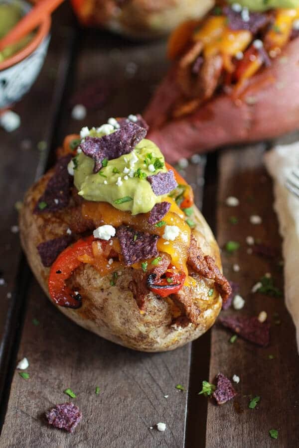 Steak Fajita Stuffed Baked Potatoes with Avocado Chipotle Crema | halfbakedharvest.com