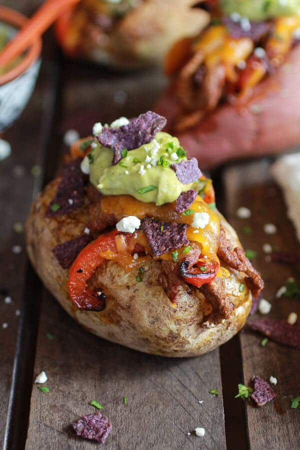Steak Fajita Stuffed Baked Potatoes with Avocado Chipotle Crema | halfbakedharvest.com