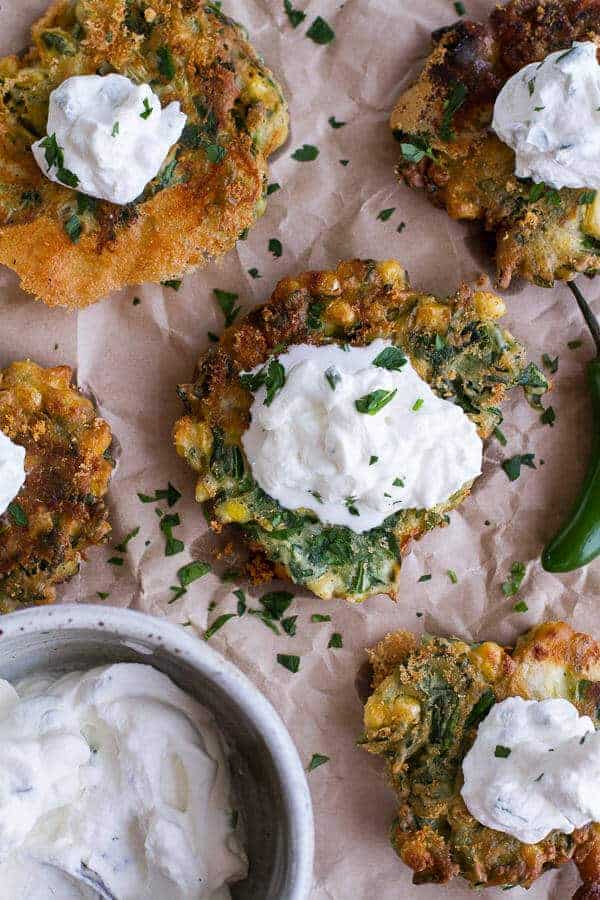 Spinach and Artichoke Corn Fritters with Brie and Sweet Honey Jalapeño Cream | halfbakedharvest.com