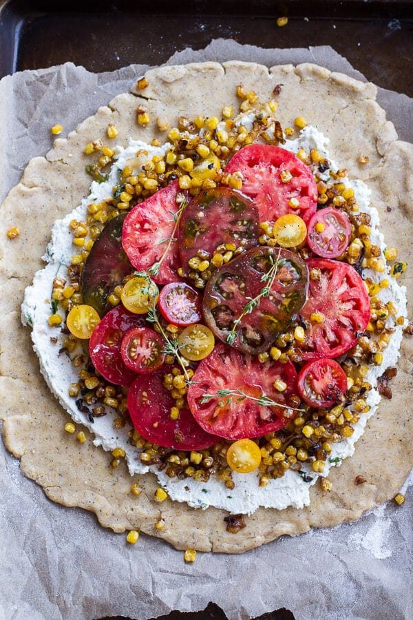Caramelized Corn and Heirloom Tomato Galette w-Herbed Roasted Garlic Goat Cheese | halfbakedharvest.com @hbharvest