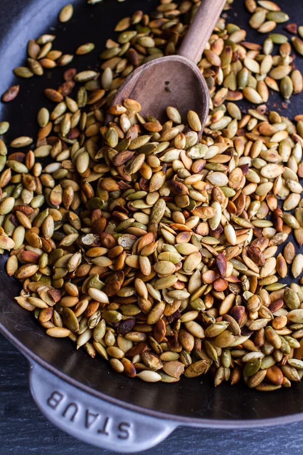 Mini Chocolate Pumpkin Seed Candy Peanut Butter Cups | halfbakedharvest.com @hbharvest