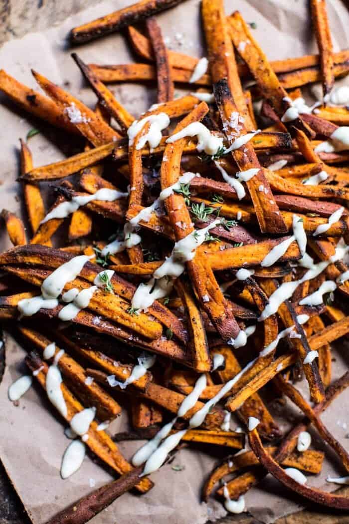 Skinny Cajun Sweet Potato Fries with Garlic Cheese Sauce | halfbakedharvest.com @hbharvest