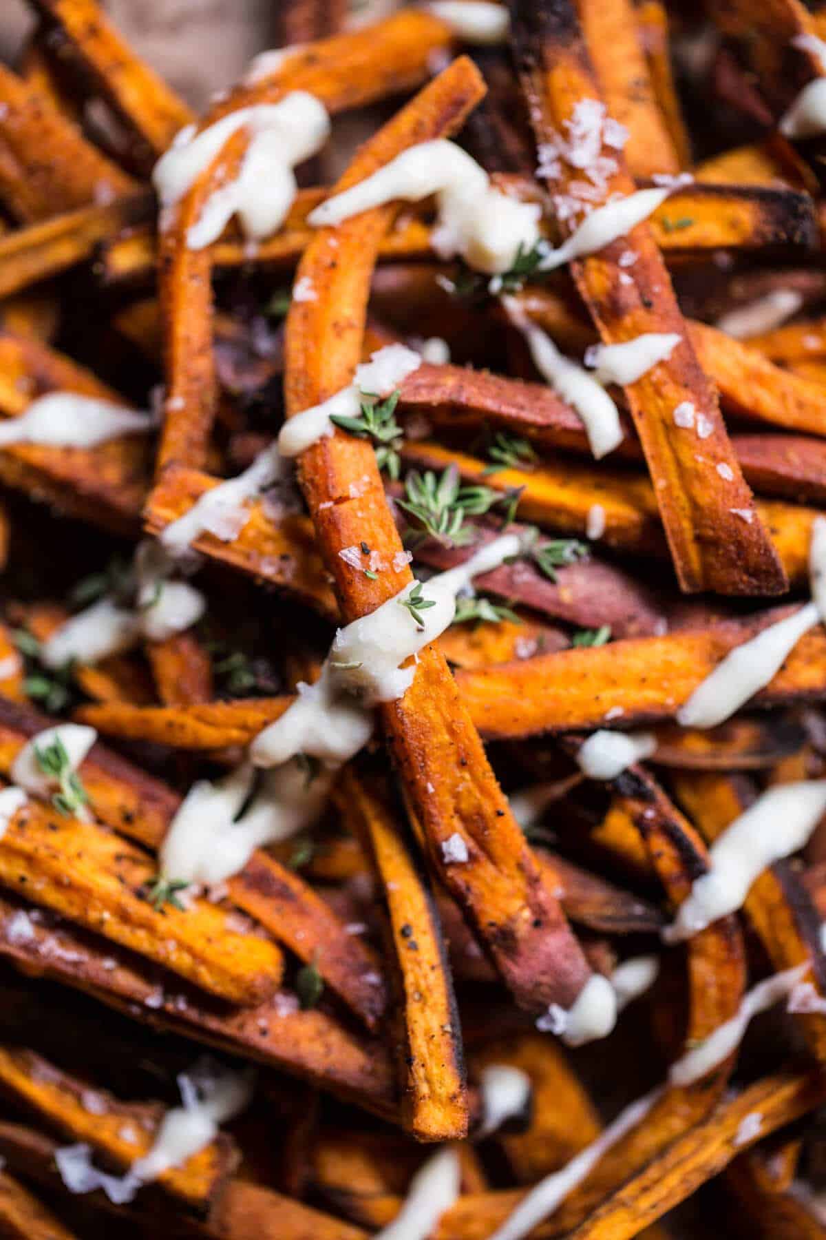 Skinny Cajun Sweet Potato Fries with Garlic Cheese Sauce | halfbakedharvest.com @hbharvest