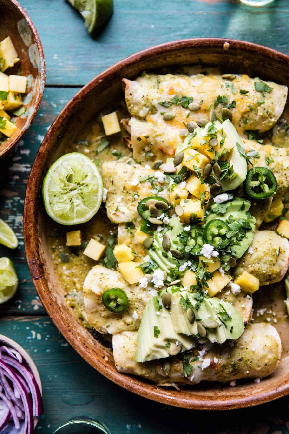 Lightened Up Salsa Verde Chicken Enchiladas with Pineapple Avocado Salsa | halfbakedharvest.com @hbharvest