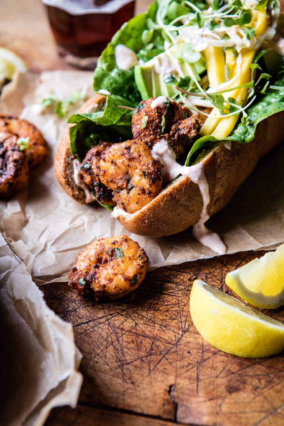 Lighter Shrimp Po Boys with Avocado Mango Slaw | halfbakedharvest.com @hbharvest