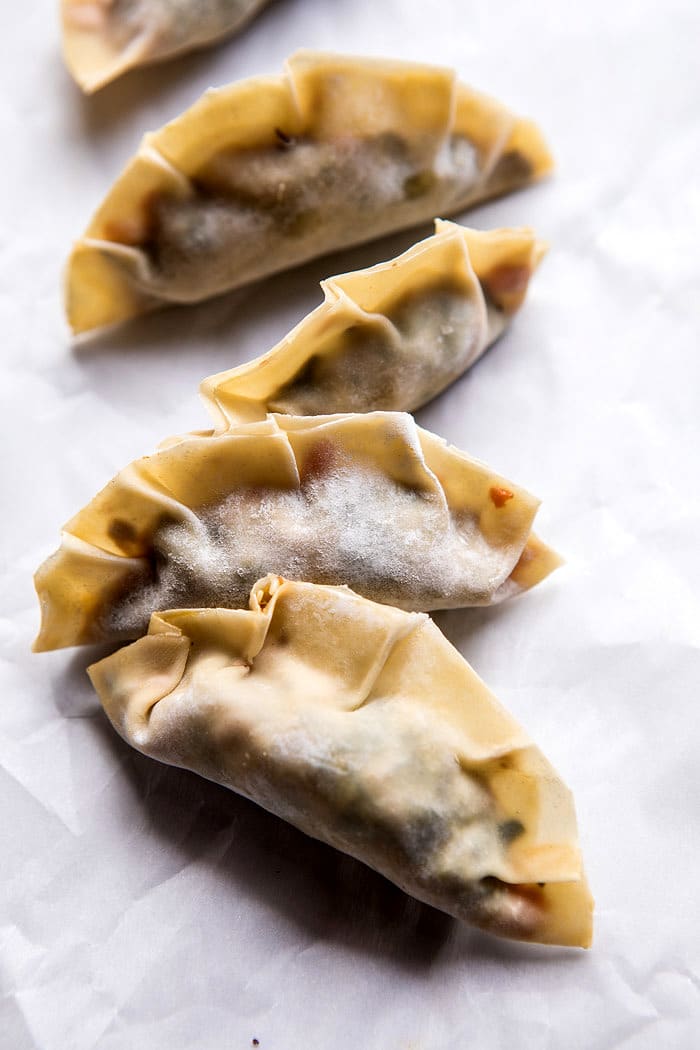 Homemade Vegetable Potstickers with Toasted Sesame Honey Soy Sauce | halfbakedharvest.com #vegan #recipes #healthy #homemade