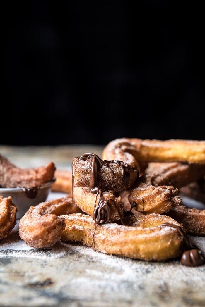 Easy Cinnamon Churros with Coffee Chocolate Sauce | halfbakedharvest.com #mexican #doughnut #dessert #chocolate