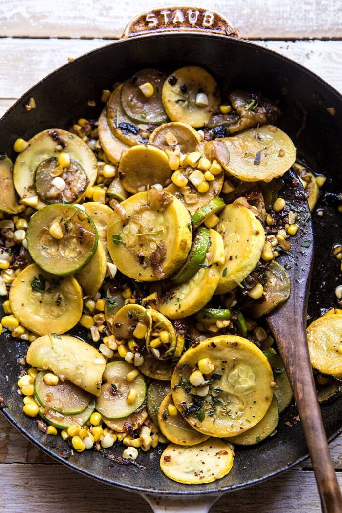 overhead photo of zucchini and corn in staub skillet 