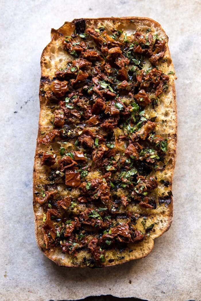 overhead photo of toasted ciabatta bread with Sun-Dried Tomato Pesto