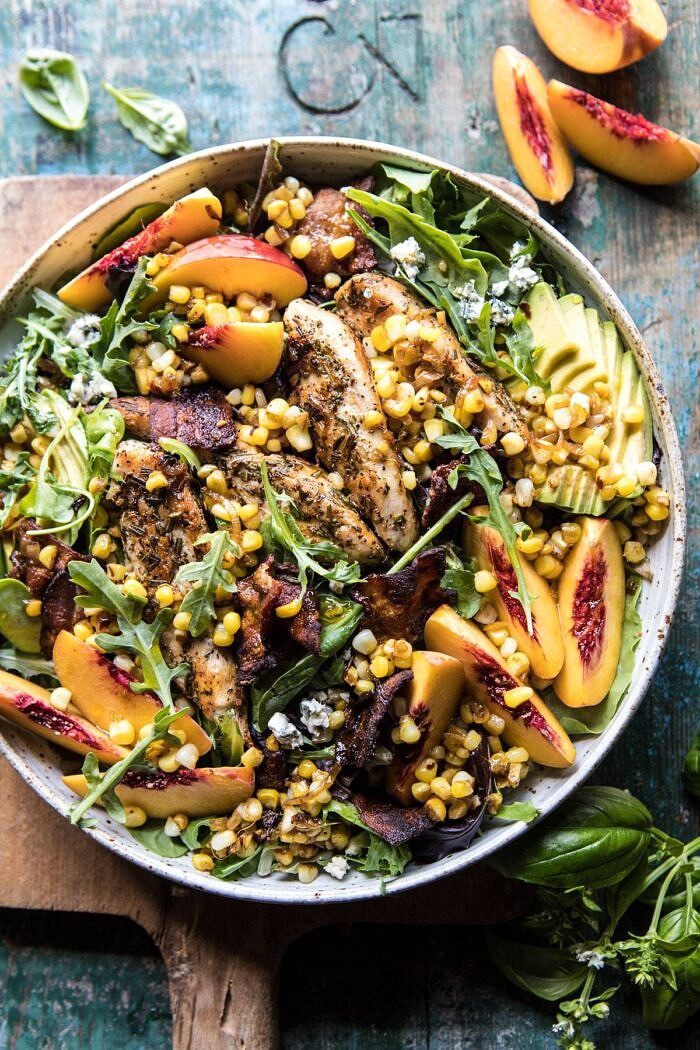 overhead photo of Rosemary Chicken, Caramelized Corn, and Peach Salad with Hot Bacon Vinaigrette with peaches and basil in photo 