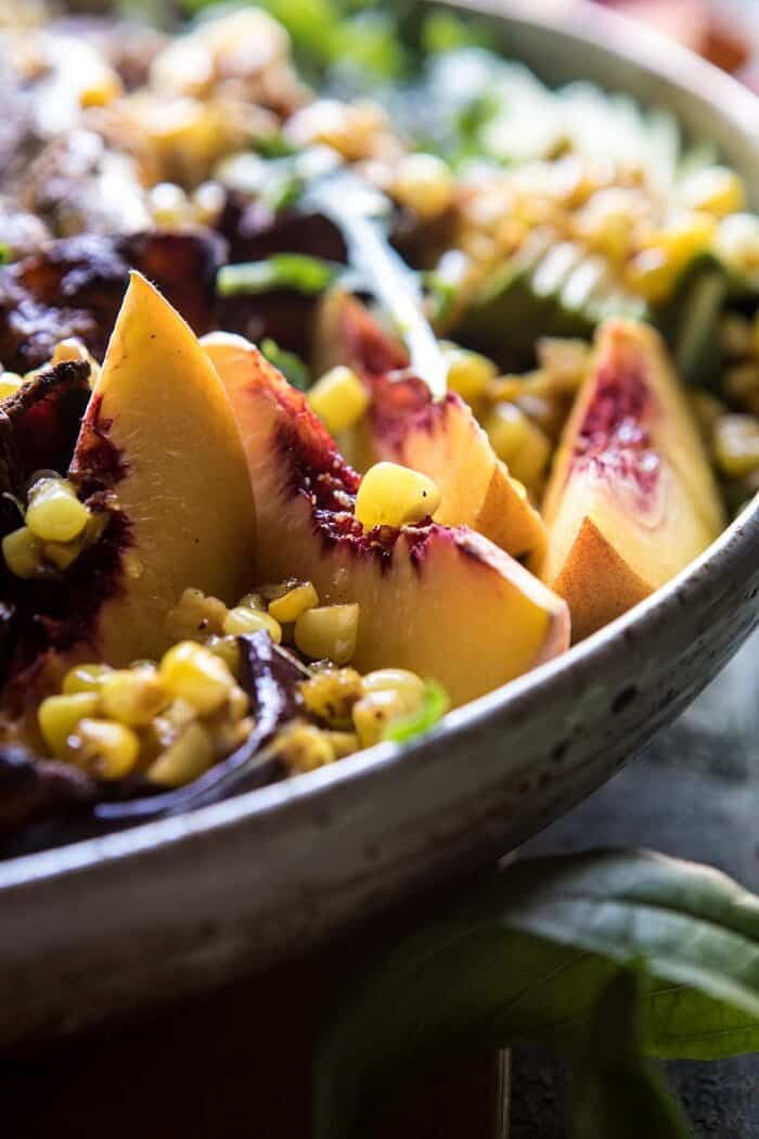 close up side angle photo of Rosemary Chicken, Caramelized Corn, and Peach Salad with Hot Bacon Vinaigrette