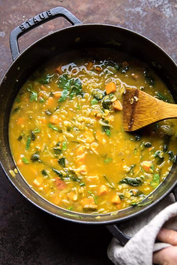 overhead photo of Coconut Sweet Potato Lentil Soup with Rice in soup pot