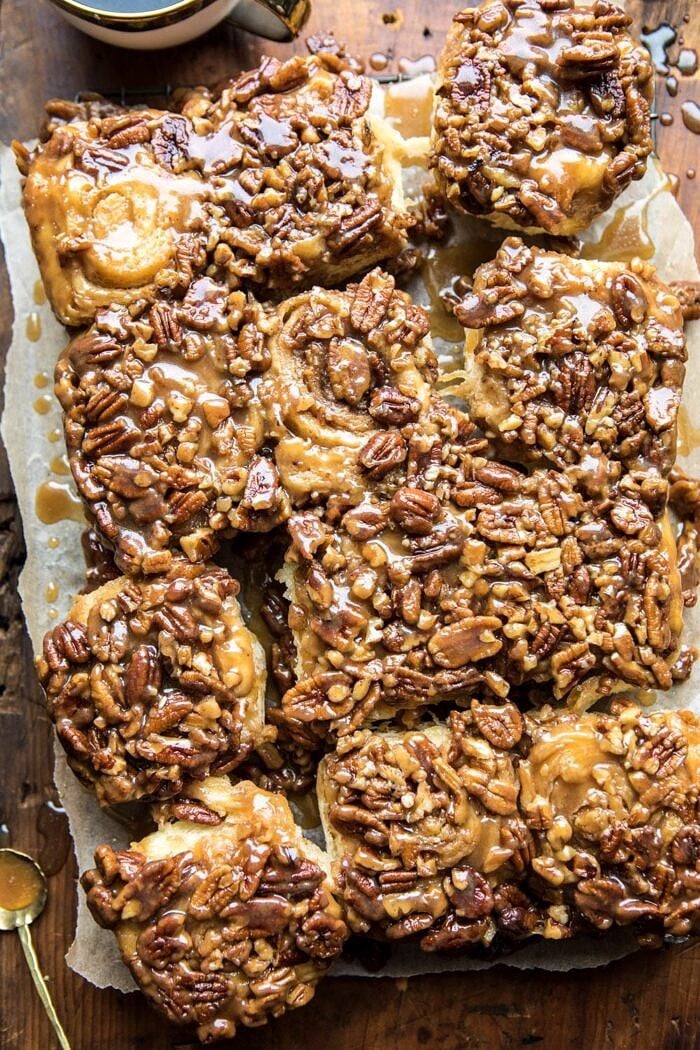 overhead photo of Extra Sticky Maple Pecan Sticky Buns with coffee mug in photo 
