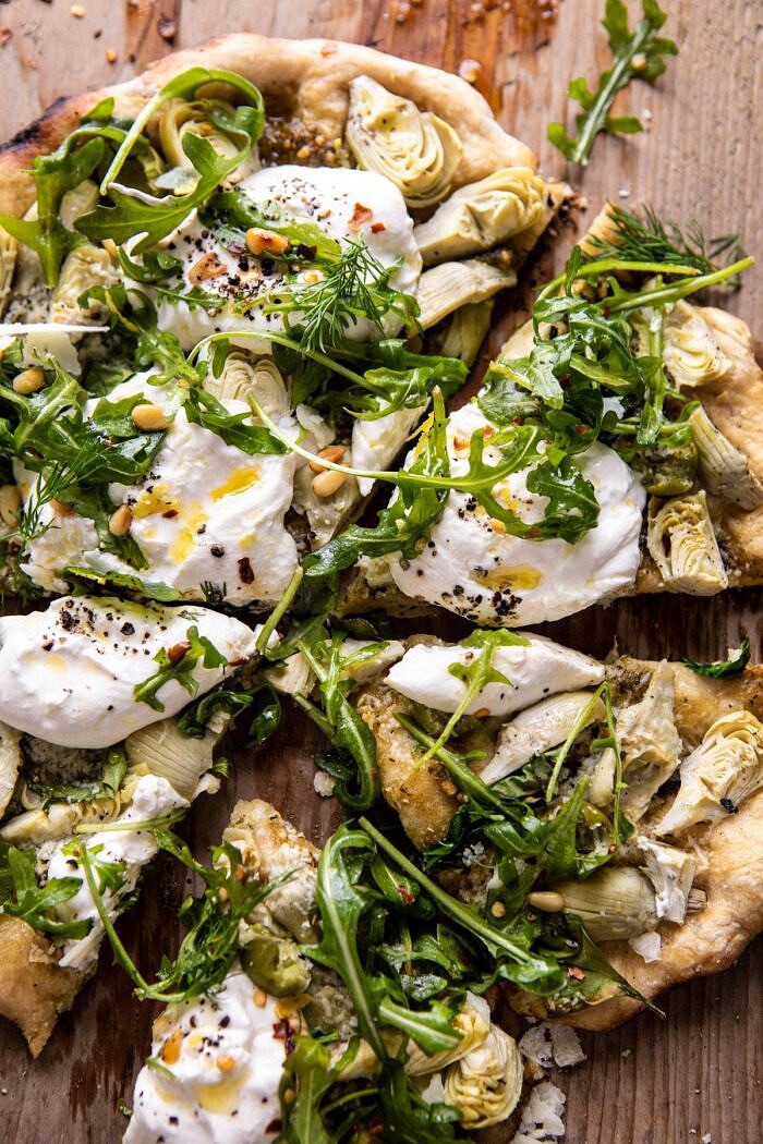 overhead close up photo of Artichoke Pesto and Burrata Pizza with Lemony Arugula 