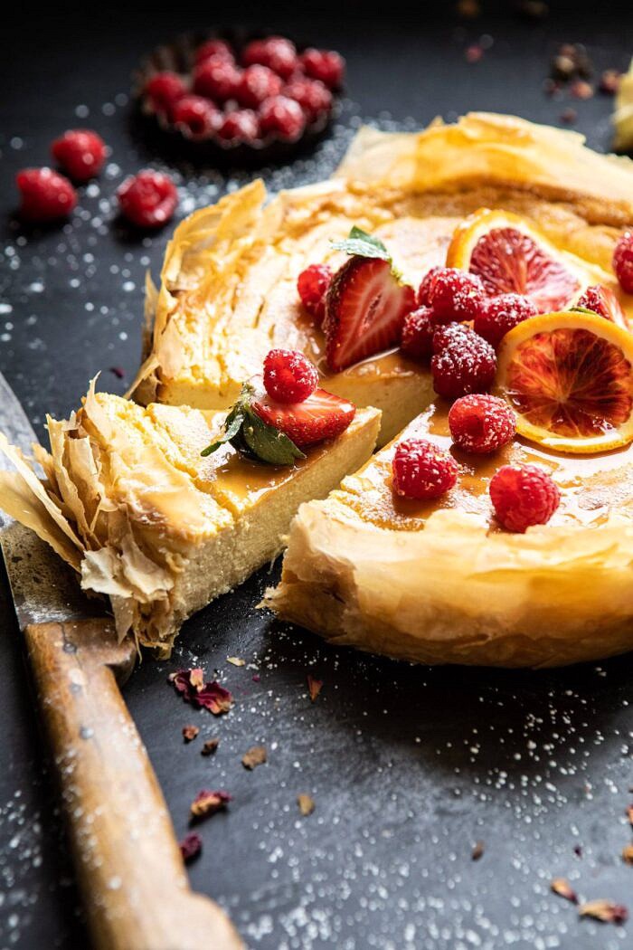 close up side angled photo of Whipped Lemon Ricotta Cheesecake with slice cut
