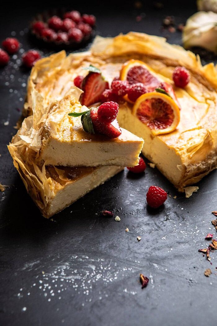 Whipped Lemon Ricotta Cheesecake with 2 slices cut and stacked on top of each other