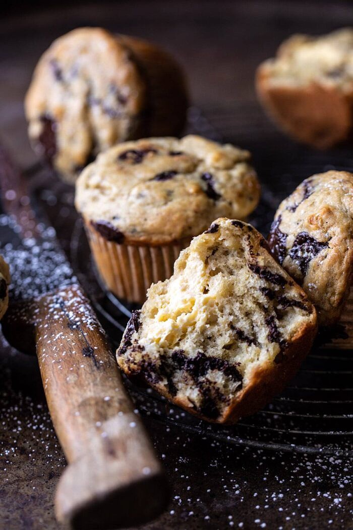 side angle photo of Cheesecake Stuffed Chocolate Chunk Banana Bread Muffin cut in half
