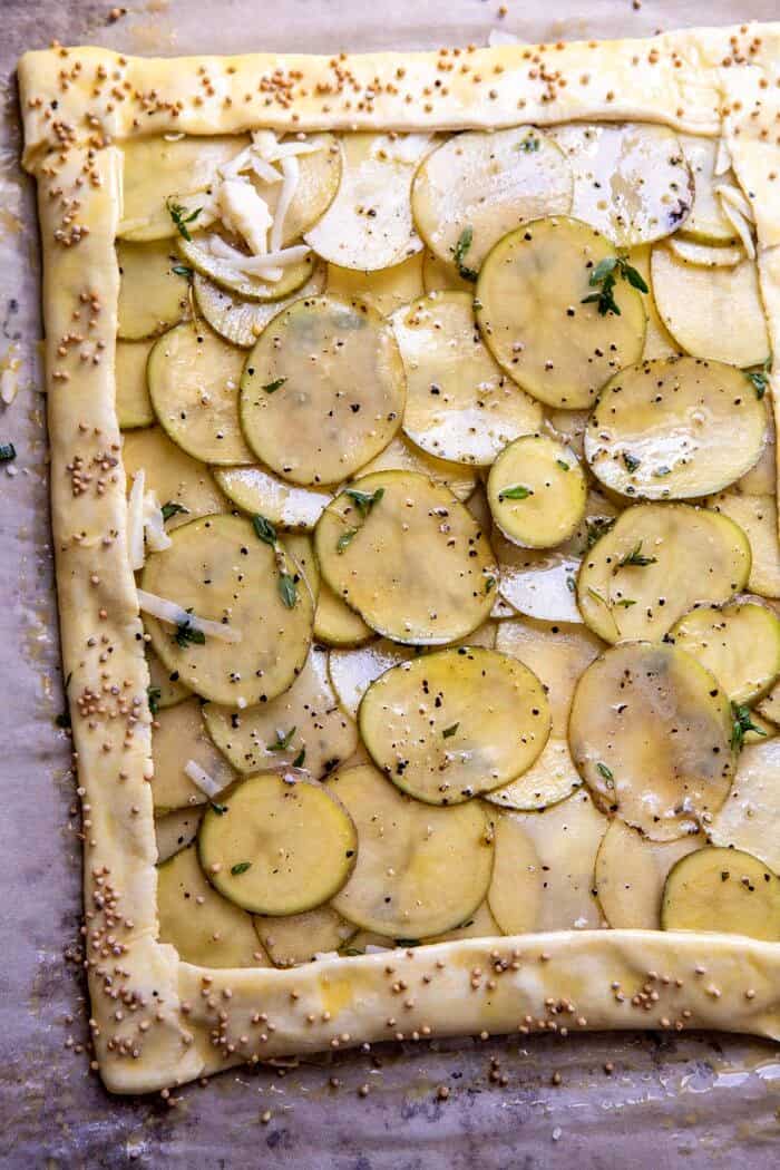 overhead photo of Cheesy Potato Chive Galette before baking