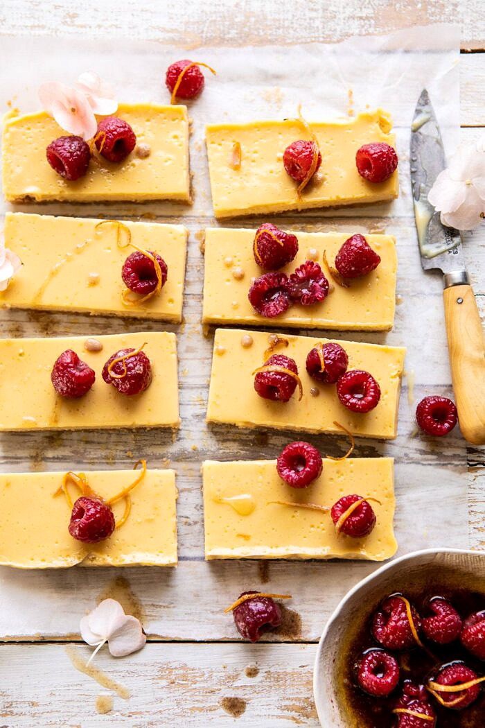 overhead photo of Creamy Lemon Bars with Browned Butter Raspberries | halfbakedharvest.com #lemon #brownbutter #spring #summer #easter #mothersday #brunch #dessert