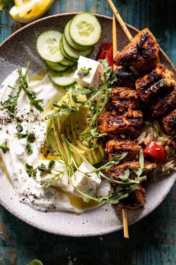 overhead close up photo of Greek Lemon Chicken Bowls with Sizzled Mint Goddess Sauce 