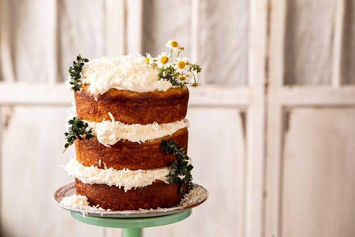 horizontal photo of Lemon Coconut Naked Cake with Whipped Vanilla Buttercream 