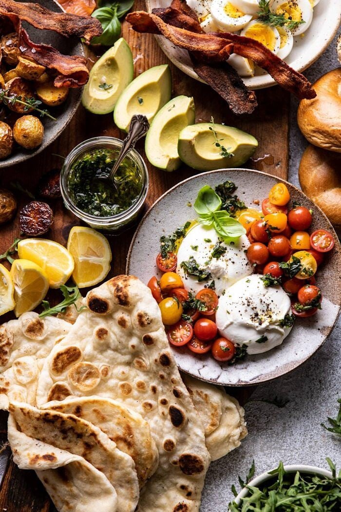 overhead photo of Ultimate Spring Brunch Board, close up photo of burrata and tomatoes 