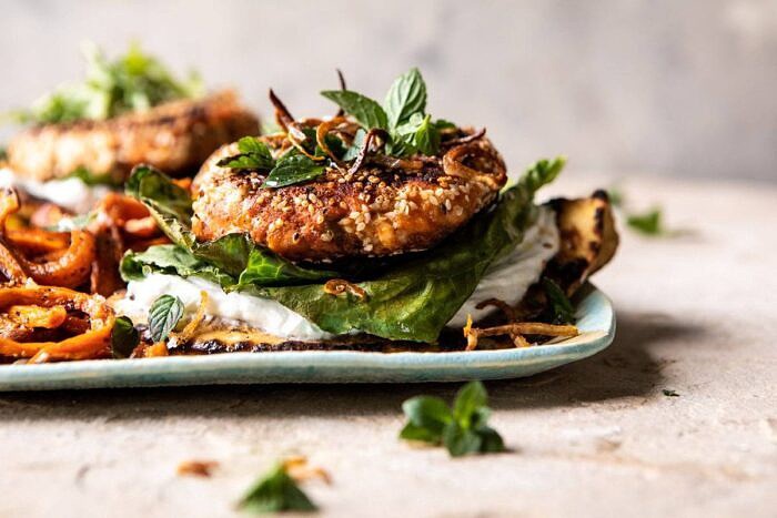 horizontal photo of Sesame Crusted Curried Salmon Burgers with Lemony Herbs 