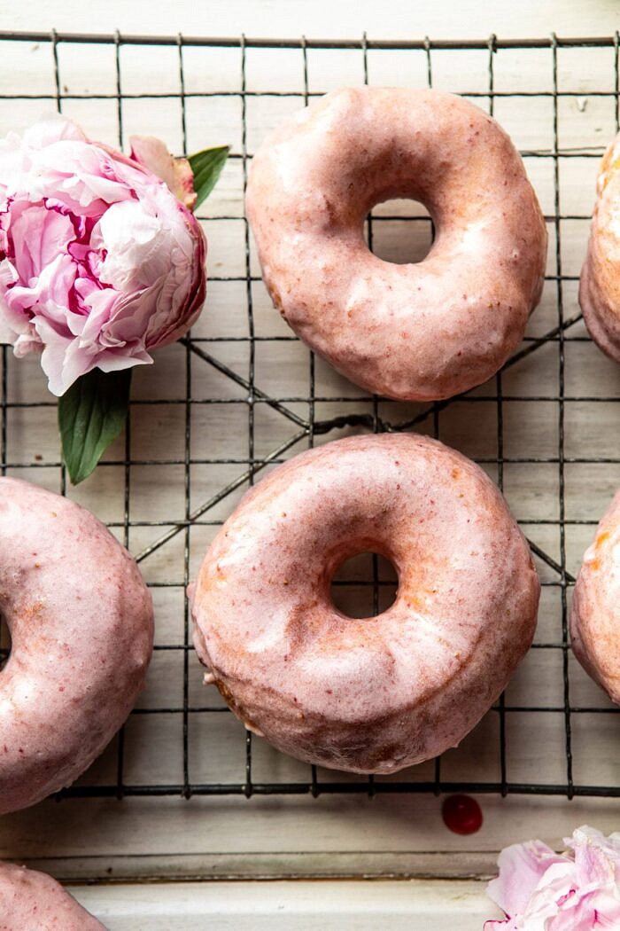overhead close up photo of Strawberry Glazed Chai Doughnuts