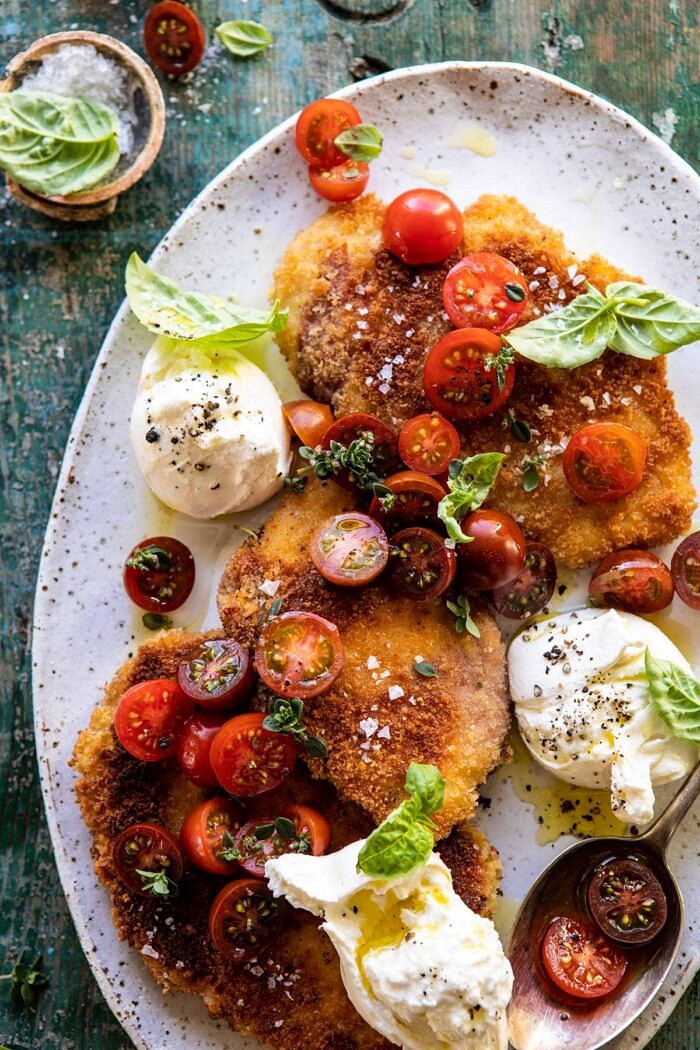 overhead close up photo of Basil Chicken Saltimbocca with Marinated Tomatoes and Burrata on platter