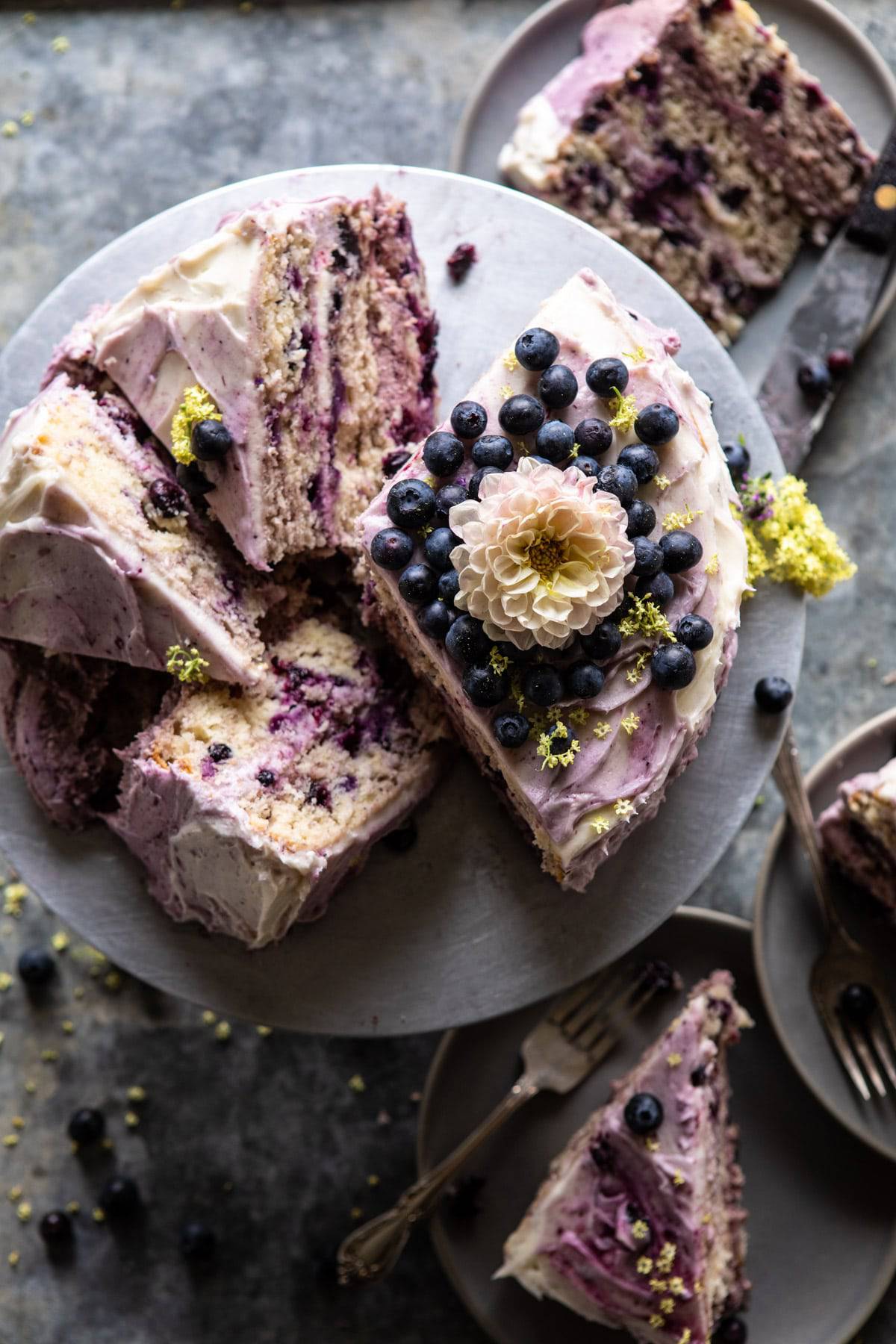 Bursting Blueberry Lemon Layer Cake | halfbakedharvest.com #bleberrycake #layercake #summerrecipes #dessert