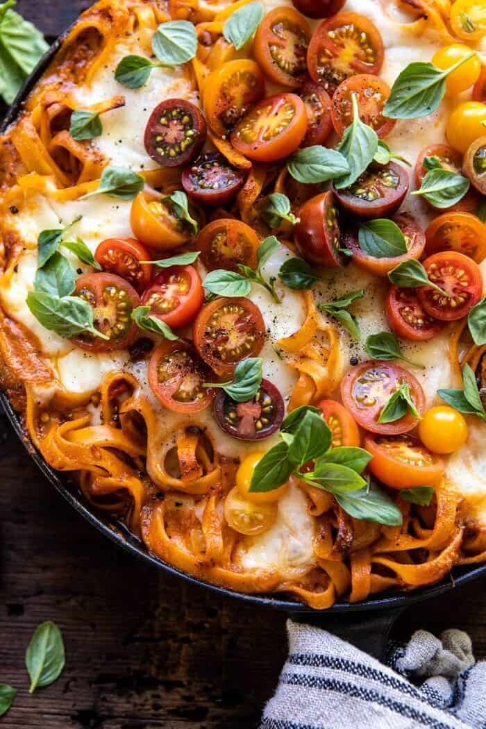 overhead close up photo of One Pot 30 Minute Creamy Tomato Basil Pasta Bake in skillet