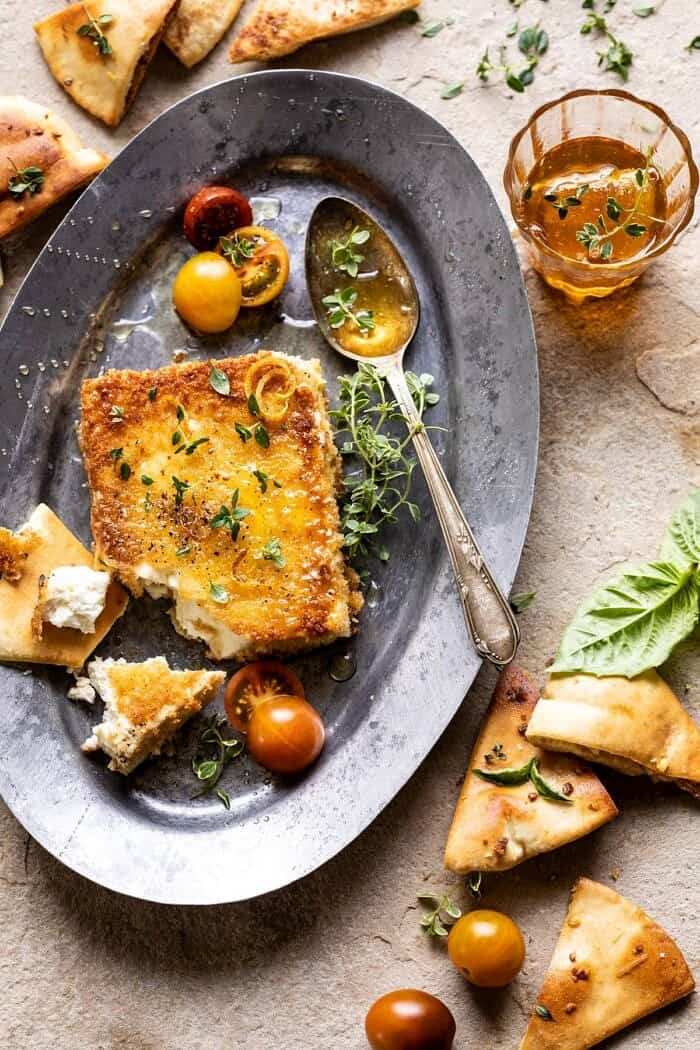 overhead photo of Pan-Fried Feta broken into pieces with Peppered Honey 