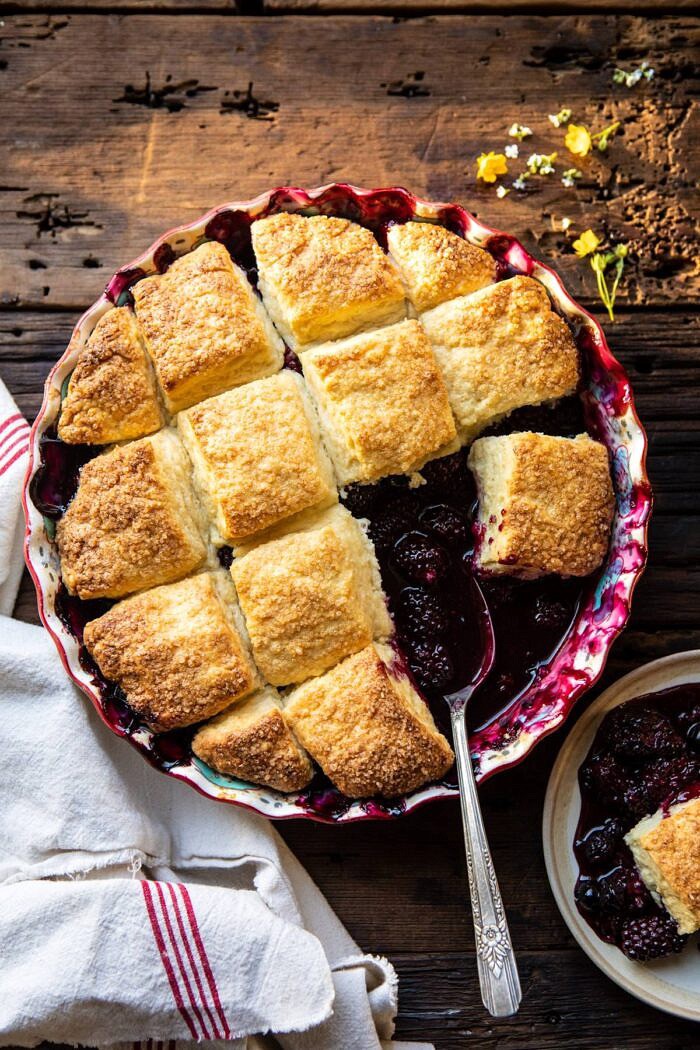 overhead photo of Blackberry Lavender Cobbler with spoon in baking dish