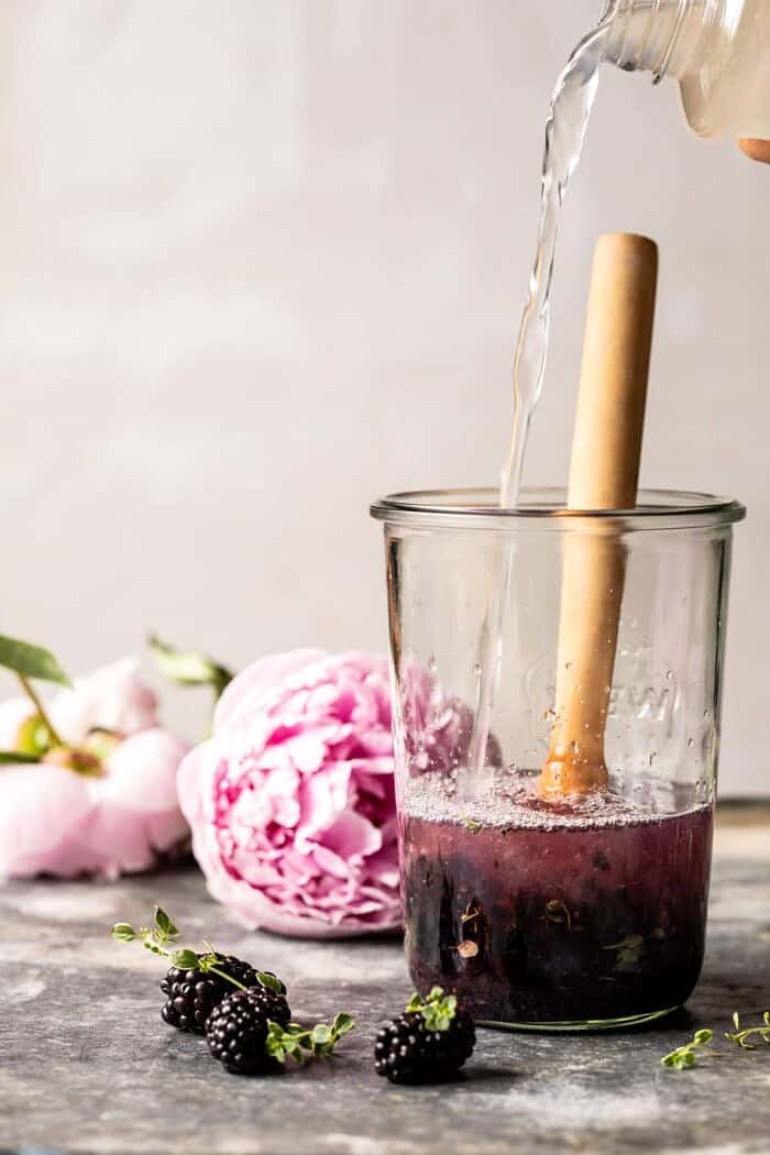 Blackberry Tequila Lemon Cooler being mixed in jar