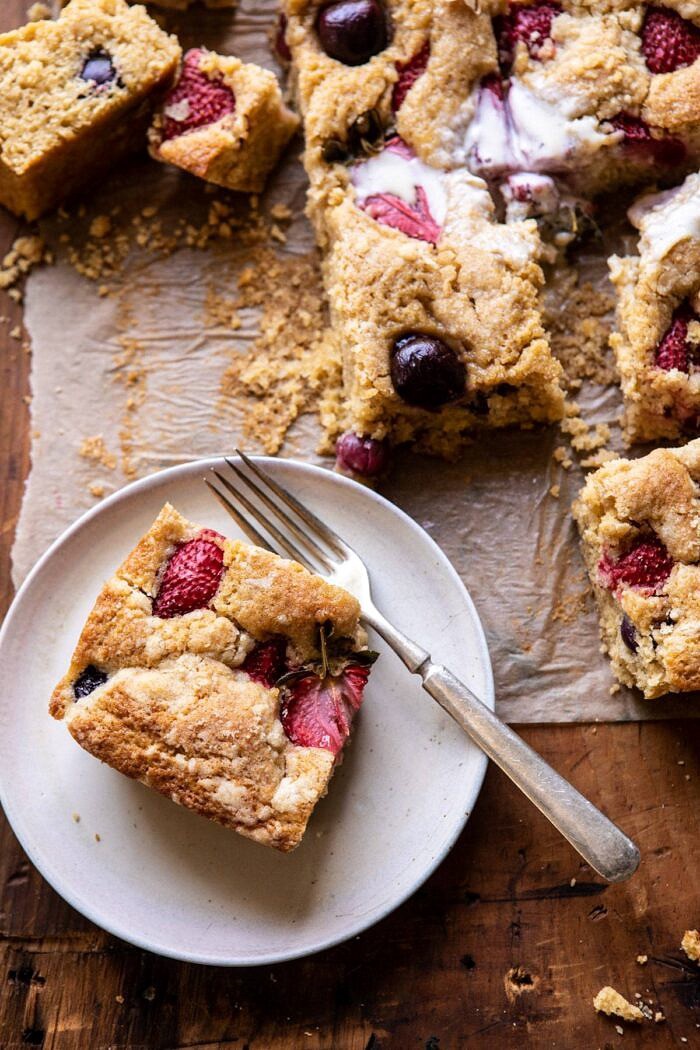 overhead close up photo of Cherry Strawberry Streusel Cake on plate with fork on plate