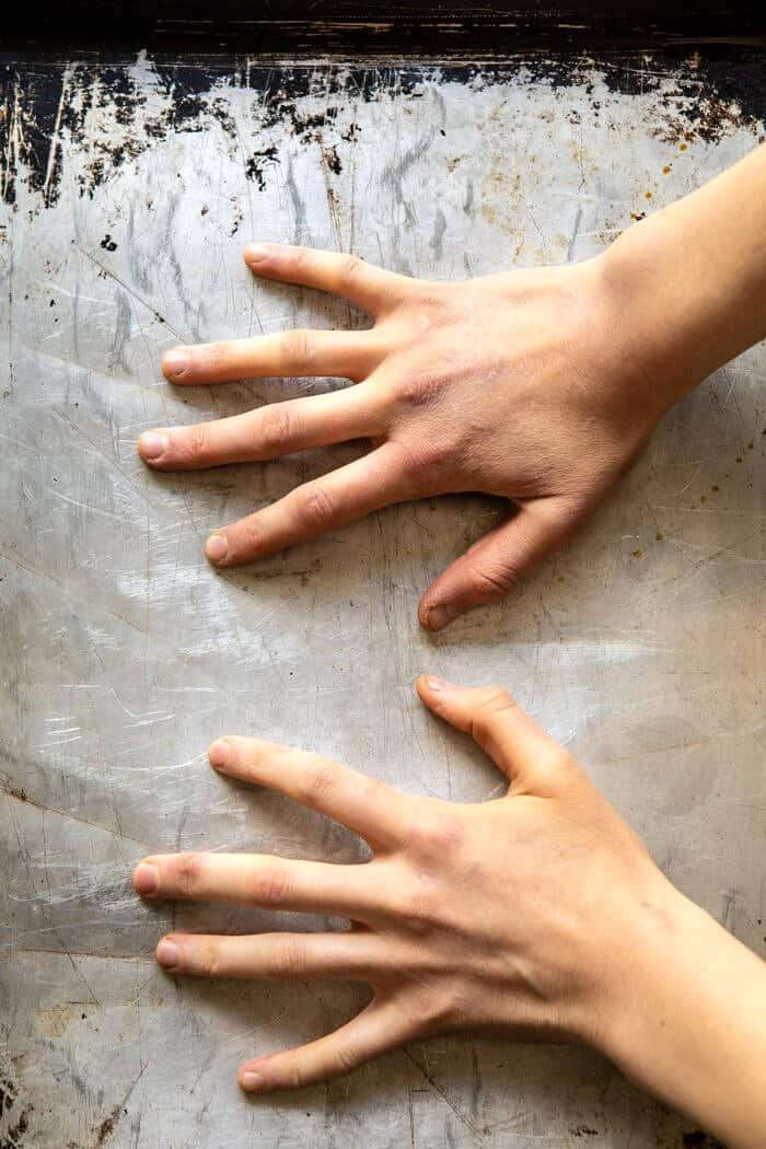 potatoes on baking sheet being smashed 