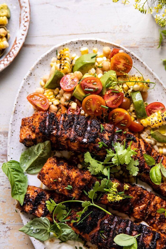 side angled photo of Lemon Parmesan Salmon with Corn, Tomato, and Avocado Salad 