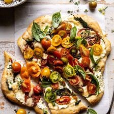 Herbed Butter Heirloom Tomato Pizza | halfbakedharvest.com #pizza #easyrecipe #tomatoes