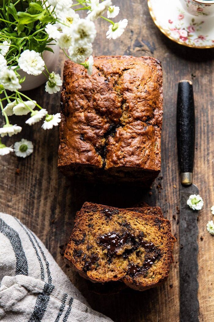 overhead photo of Sneaky Zucchini Chocolate Chunk Coconut Bread with 1 slice cut to show chocolate inside