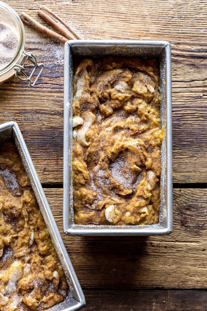 overhead photo of Cream Cheese Swirled Pumpkin Bread in bread pan before baking 