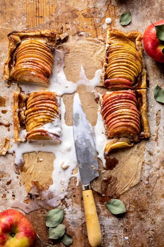 overhead photo of Chai Spiced Apple Ricotta Galette with slices of the tart removed and melted ice cream 