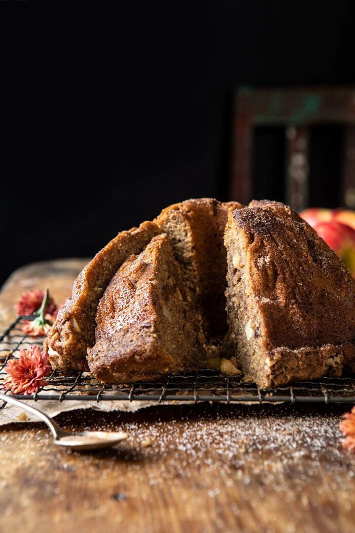 close up side angled photo of Spiced Pecan Apple Cider Doughnut Cake with slice cut