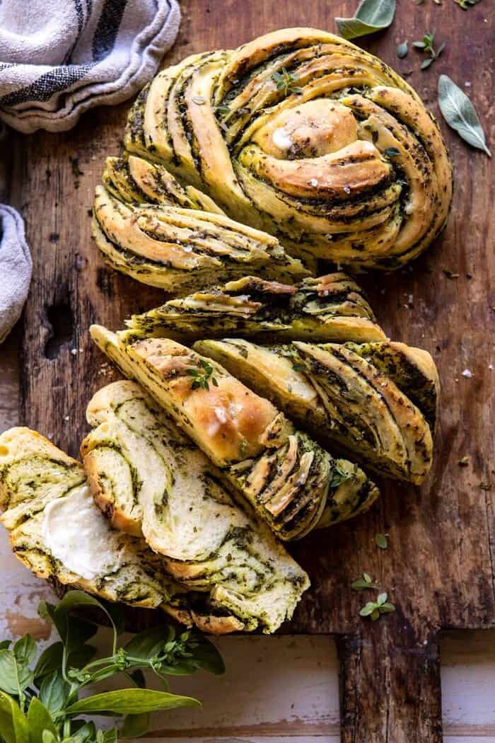 overhead photo of Swirled Garlic Herb Bread with multiple slices cut