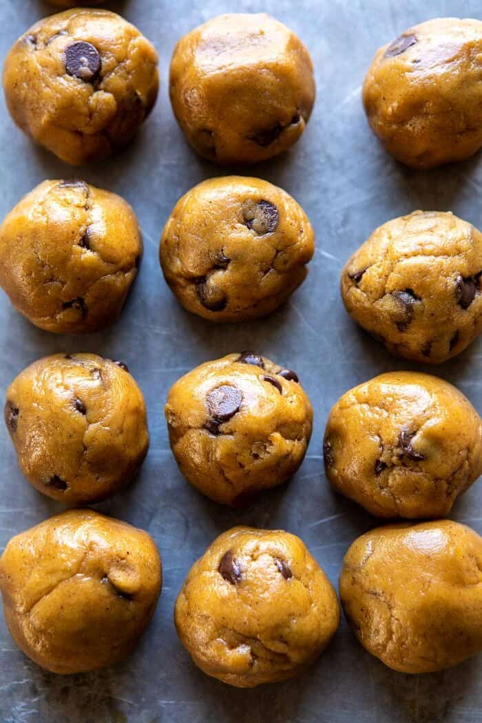 overhead photo of Pumpkin Butter Chocolate Chip Cookie dough balls on baking sheet