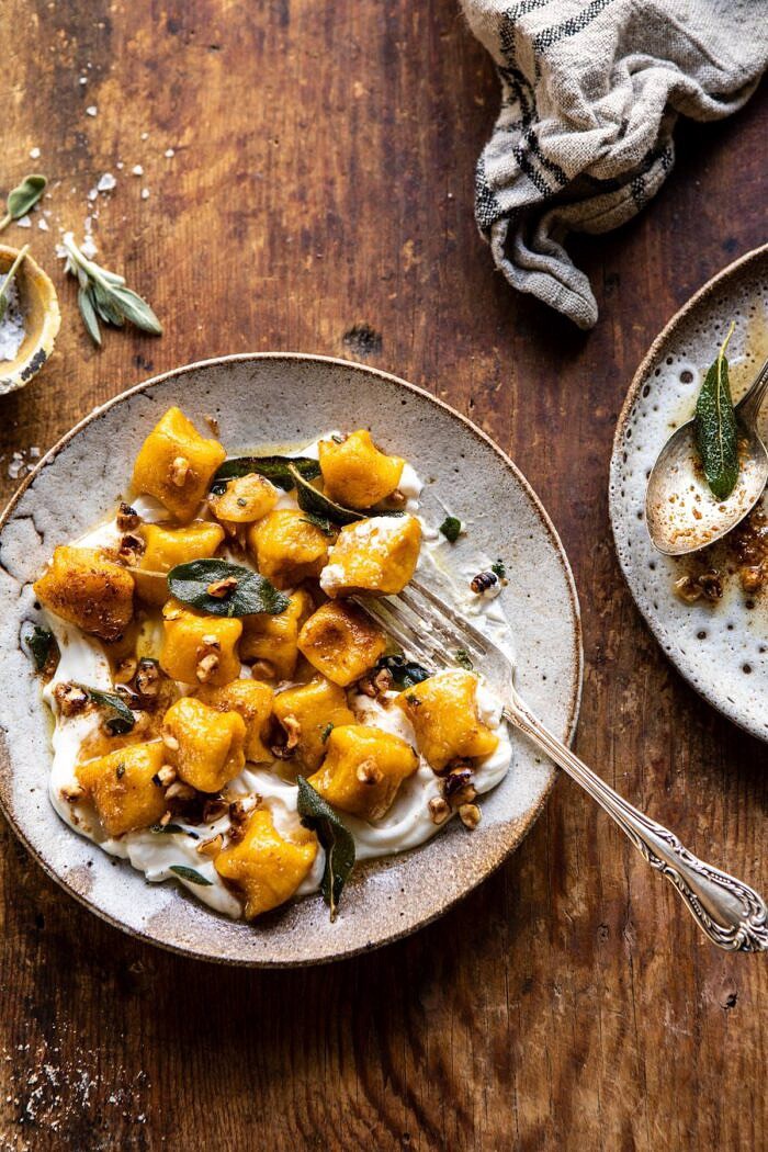 overhead photo of Pumpkin Cauliflower Gnocchi with Nutty Browned Butter and Whipped Ricotta and fork gnocchi with ricotta on gnocchi