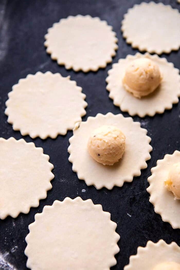 assembling Pierogies with potatoes in center of dough