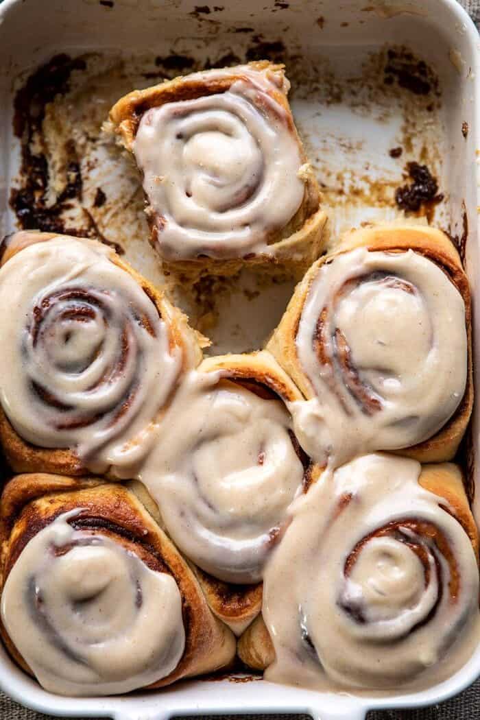 overhead close up photo of Easy Gingerbread Brioche Cinnamon Rolls in baking pan