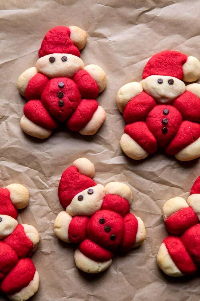 overhead photo of Holly Jolly Santa Cookies after baking on baking sheet