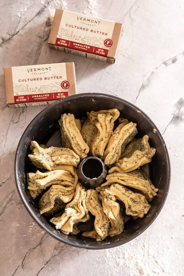 overhead photo of Pull-Apart Garlic Butter Bread Wreath in bundt pan before baking 